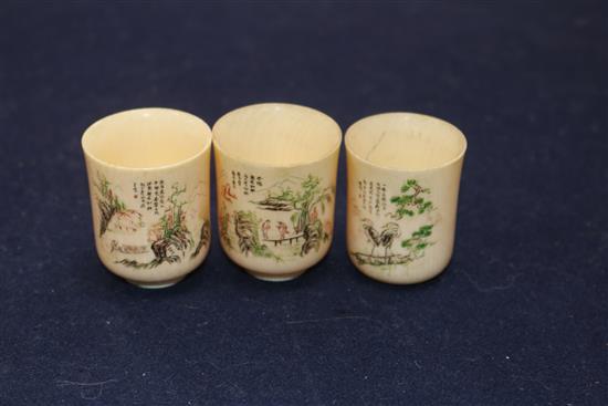 Three Chinese ivory cups, Republic period and four Japanese miniature ivory figures of immortals